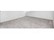 This is a carpeted bedroom with white walls, base trim, and a window at 5809 N Illinois St, Indianapolis, IN 46208