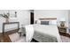 This modern bedroom features a plush bed, accent rug and tasteful decor creating a relaxing retreat at 5809 N Illinois St, Indianapolis, IN 46208
