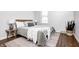 This modern bedroom features a plush bed, stylish side tables, hardwood floors and a cozy rug at 5809 N Illinois St, Indianapolis, IN 46208