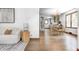 Inviting open-concept layout with hardwood floors, bright lighting and a view into the kitchen at 5809 N Illinois St, Indianapolis, IN 46208