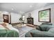 Bright living room with hardwood floors, fireplace, neutral colors, and comfortable seating at 5809 N Illinois St, Indianapolis, IN 46208