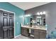Bathroom with dual vanity, updated fixtures, and calming paint color at 5850 Lyster Ln, Indianapolis, IN 46239