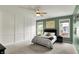 Lovely primary bedroom featuring many windows and modern trim and decor at 5850 Lyster Ln, Indianapolis, IN 46239