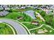Picturesque community featuring a serene pond with fountain, walking paths, and covered seating areas amid lush landscaping at 5850 Lyster Ln, Indianapolis, IN 46239