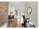 Open-concept home entry with views of living spaces, dining area, and sleek interior design at 5850 Lyster Ln, Indianapolis, IN 46239
