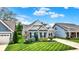 Charming single-Gathering home boasts a manicured lawn and inviting curb appeal at 5850 Lyster Ln, Indianapolis, IN 46239