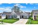 Beautiful home with a well-maintained lawn, landscape, and charming facade at 5850 Lyster Ln, Indianapolis, IN 46239