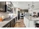 Modern kitchen featuring stainless steel appliances, a kitchen island and generous countertop space at 5850 Lyster Ln, Indianapolis, IN 46239
