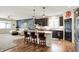 Stylish kitchen featuring a center island with bar seating, stainless steel appliances, and modern finishes at 5850 Lyster Ln, Indianapolis, IN 46239