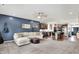Spacious living room showcasing open floorplan into kitchen, neutral tones, and ample natural light at 5850 Lyster Ln, Indianapolis, IN 46239