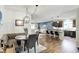 Open-concept living space with dining area, modern kitchen, and comfortable lounge area for seamless living at 5850 Lyster Ln, Indianapolis, IN 46239