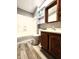 Bathroom featuring vinyl flooring, a vanity, toilet, and tub-shower combination at 6538 N Tutterow Rd, Monrovia, IN 46157