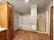 Full bathroom featuring vanity, storage cabinet, shower and tub combo, and wood-look flooring at 6538 N Tutterow Rd, Monrovia, IN 46157