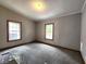 Bedroom featuring neutral carpet, gray walls, white trim, and two windows providing natural light at 6538 N Tutterow Rd, Monrovia, IN 46157