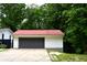 Detached two-car garage with concrete driveway and mature landscaping at 6538 N Tutterow Rd, Monrovia, IN 46157