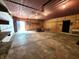 Spacious garage interior with high ceilings and ample storage space, including room for a lawn tractor at 6538 N Tutterow Rd, Monrovia, IN 46157