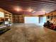 Interior view of garage with shelves for storage, high ceilings and room for a lawn tractor at 6538 N Tutterow Rd, Monrovia, IN 46157