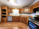 Kitchen featuring wood cabinets, laminate flooring, stainless steel appliances, and ample counter space at 6538 N Tutterow Rd, Monrovia, IN 46157