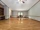 Spacious living room with light wood laminate flooring, with natural light, neutral paint and wood trim at 6538 N Tutterow Rd, Monrovia, IN 46157