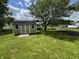 Wide shot of backyard with storage shed, garden, trees and plenty of room for activities at 660 White Ash Trail, Mooresville, IN 46158