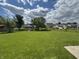 Large backyard features a storage shed, garden and mature trees in a neighborhood at 660 White Ash Trail, Mooresville, IN 46158