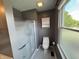 Well-maintained bathroom featuring a glass-enclosed shower and neutral tile flooring at 660 White Ash Trail, Mooresville, IN 46158