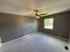 Cozy bedroom with plush carpet, a ceiling fan, and ample natural light at 660 White Ash Trail, Mooresville, IN 46158