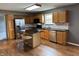 Well-lit kitchen featuring stainless steel appliances, tile backsplash, and wood cabinetry at 660 White Ash Trail, Mooresville, IN 46158