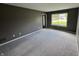 Inviting living room featuring neutral carpet, a large window, and ample natural light at 660 White Ash Trail, Mooresville, IN 46158