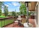 Back deck area with seating offering views of the expansive yard, perfect for relaxing or entertaining guests at 6605 Grosvenor Pl, Indianapolis, IN 46220