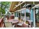 Back deck featuring an outdoor heater and sliding doors offering a seamless transition to indoor living spaces at 6605 Grosvenor Pl, Indianapolis, IN 46220