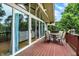 Enjoy outdoor living on this wooden deck, complete with a seating area and views of the lush backyard at 6605 Grosvenor Pl, Indianapolis, IN 46220