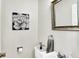 Elegant half bathroom with stylish fixtures and tasteful decor elements at 6605 Grosvenor Pl, Indianapolis, IN 46220