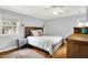 Comfortable bedroom with hardwood floors, ceiling fan, and a cozy atmosphere at 6605 Grosvenor Pl, Indianapolis, IN 46220