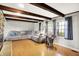 Well-lit living room with hardwood floors, recessed lighting, and comfortable sectional at 6605 Grosvenor Pl, Indianapolis, IN 46220