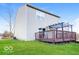 A well-manicured lawn and a wooden deck enhance this home's backyard appeal at 6756 Wimbledon Dr, Zionsville, IN 46077