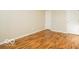 A well-lit bedroom featuring durable, wood-look laminate flooring and neutral wall colors at 6756 Wimbledon Dr, Zionsville, IN 46077