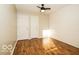 Bedroom features a light wood floor, white horizontal shiplap, and two white doors at 6756 Wimbledon Dr, Zionsville, IN 46077