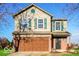 Charming two-story home features a front-facing two-car garage, green shutters, and a well-maintained lawn at 6756 Wimbledon Dr, Zionsville, IN 46077