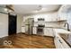 Modern kitchen featuring subway tile backsplash, stainless steel appliances, and stylish pendant lighting at 6756 Wimbledon Dr, Zionsville, IN 46077