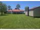 Expansive backyard with lush green grass, trees, and well-maintained landscaping at 705 S 450 E, Franklin, IN 46131