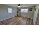 Bright bedroom featuring hardwood floors, ceiling fan, and neutral paint at 705 S 450 E, Franklin, IN 46131