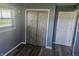 Bedroom with a built-in closet and hardwood floors, illuminated by natural light from the window at 705 S 450 E, Franklin, IN 46131