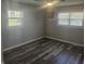 Bright bedroom with laminate floors, neutral walls, and bright windows at 705 S 450 E, Franklin, IN 46131