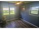 Cozy bedroom featuring a ceiling fan and beautiful natural light, and hardwood floors at 705 S 450 E, Franklin, IN 46131