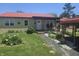 Charming single-story home with a red roof, stone facade, covered porch and beautifully landscaped front yard at 705 S 450 E, Franklin, IN 46131