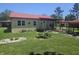 Well-maintained single-story home with a red roof and unique stone facade, surrounded by a lush green lawn at 705 S 450 E, Franklin, IN 46131