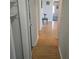 Hallway with wood flooring leading to rooms with natural light at 705 S 450 E, Franklin, IN 46131