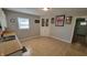 Eat-in kitchen featuring tiled flooring, white corner cabinets, and bright natural light at 705 S 450 E, Franklin, IN 46131