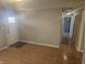 Bright, open living room with durable floors and neutral paint, showcasing a view into the hallway at 705 S 450 E, Franklin, IN 46131